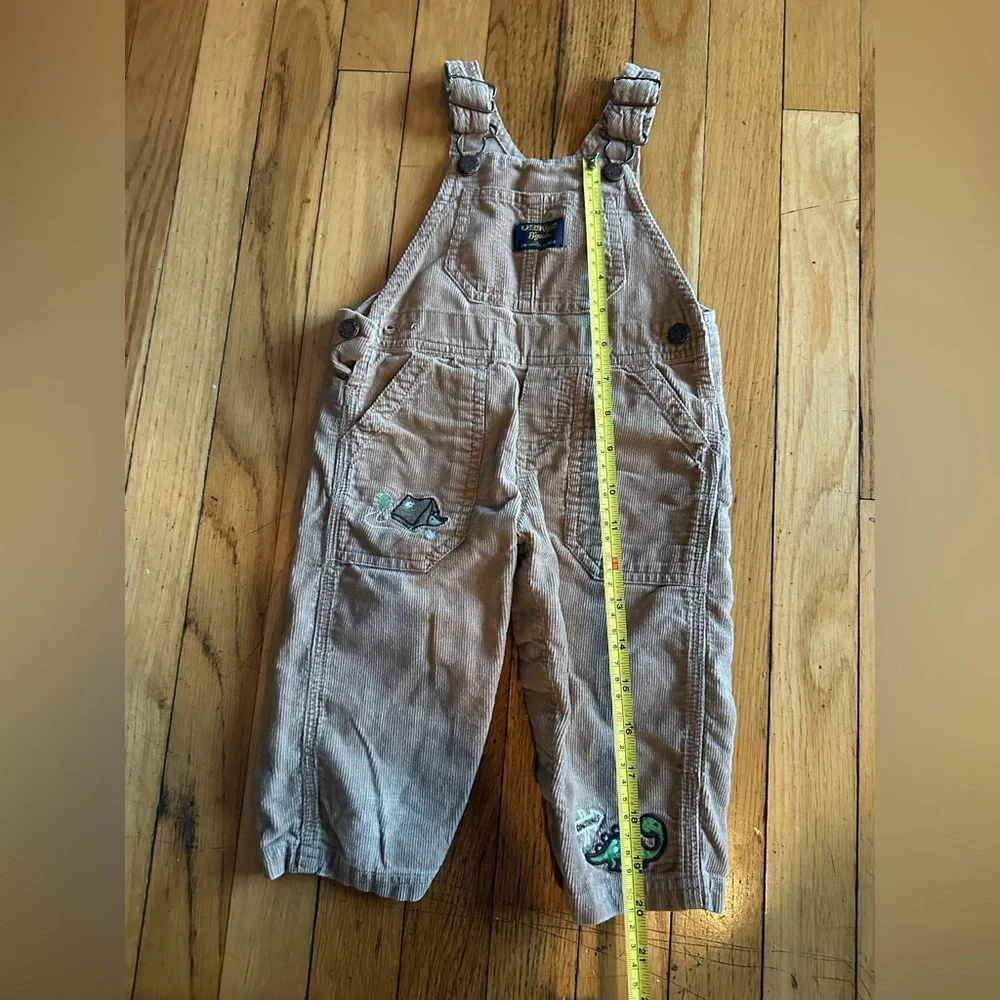 Oshkosh B’gosh Boy’s Size 12M  Tan Overalls w Dinosaurs Embroidery